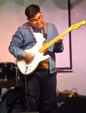 Jesus playing the Squier Strat for Boutique V @ the Stuffed Potato, 6.28.23